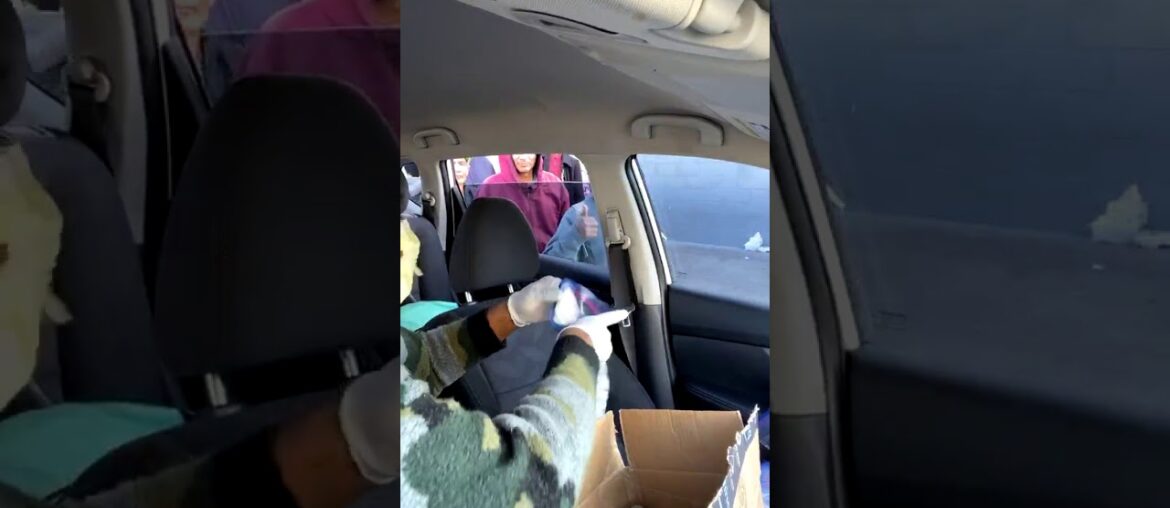 A Woman Gives Some Homeless People Vitamin C And Hand Santizer Amid The Coronavirus Pandemic...