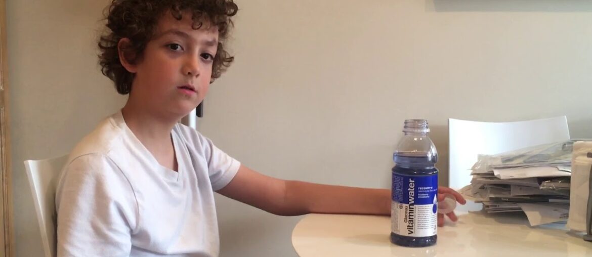 Casey drinking vitamin water for the first time