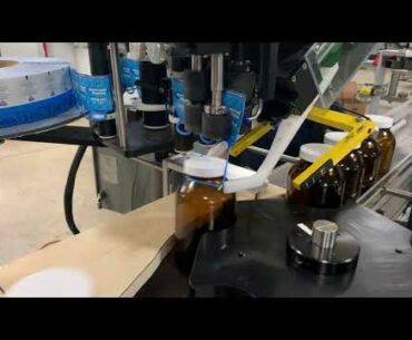 Elastic Tags on Vitamin & Supplement Bottles running threw star wheel