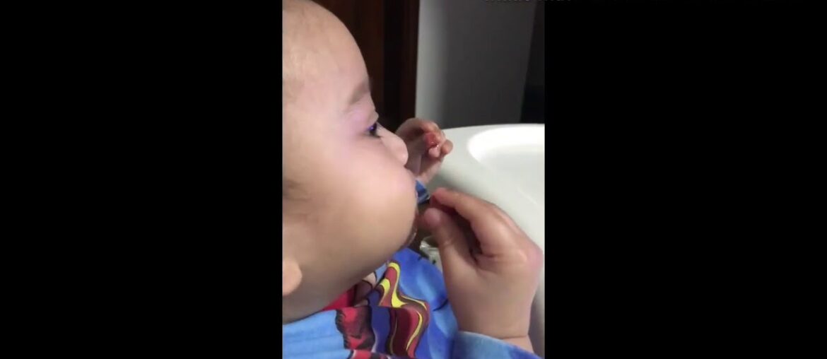 Baby eating Sunshine Nutrition gummy vitamins