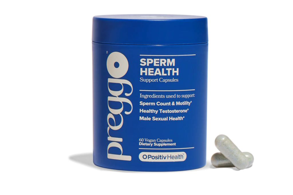 A jar of supplements for men, with two pills on the side.