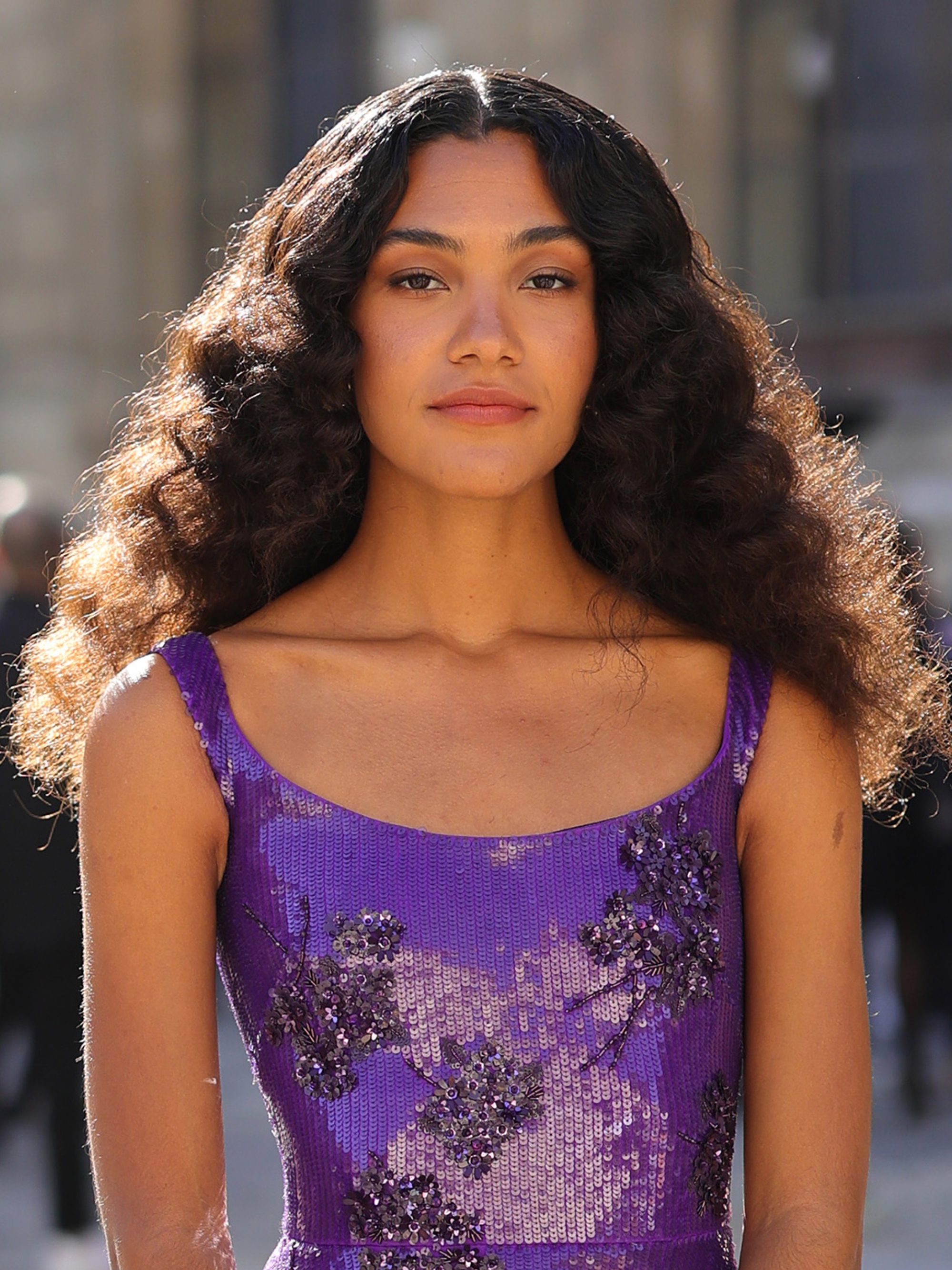 Olivia Dean attends the Valentino Womenswear spring/summer 2024 show during Paris Fashion Week with a matte eye makeup look and flushed cheeks