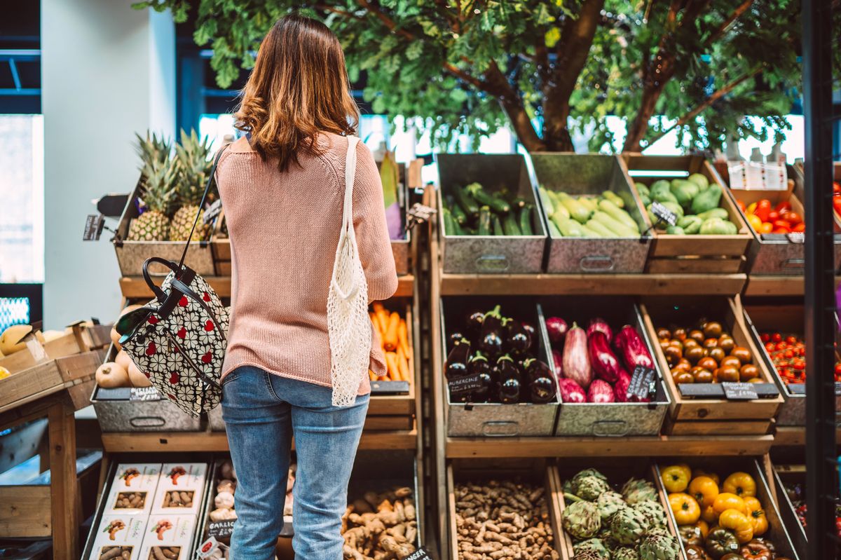 Woman in supermarket stock photo