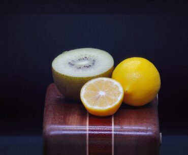 a piece of fruit sitting on top of a wooden box