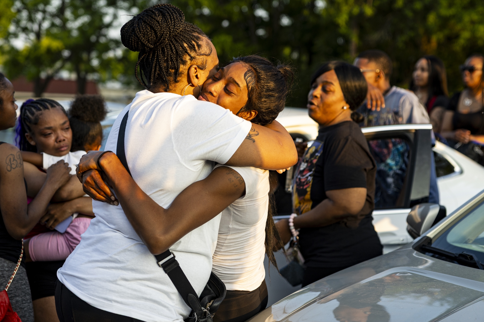 Crystal Frost hugs Shatoya Green during a commemoration of life for Shaquice Grear on Saturday, June 14, 2025, in the 3100 block of Flushing Road in Flint. Grear was shot on May 25 and passed on May 30.