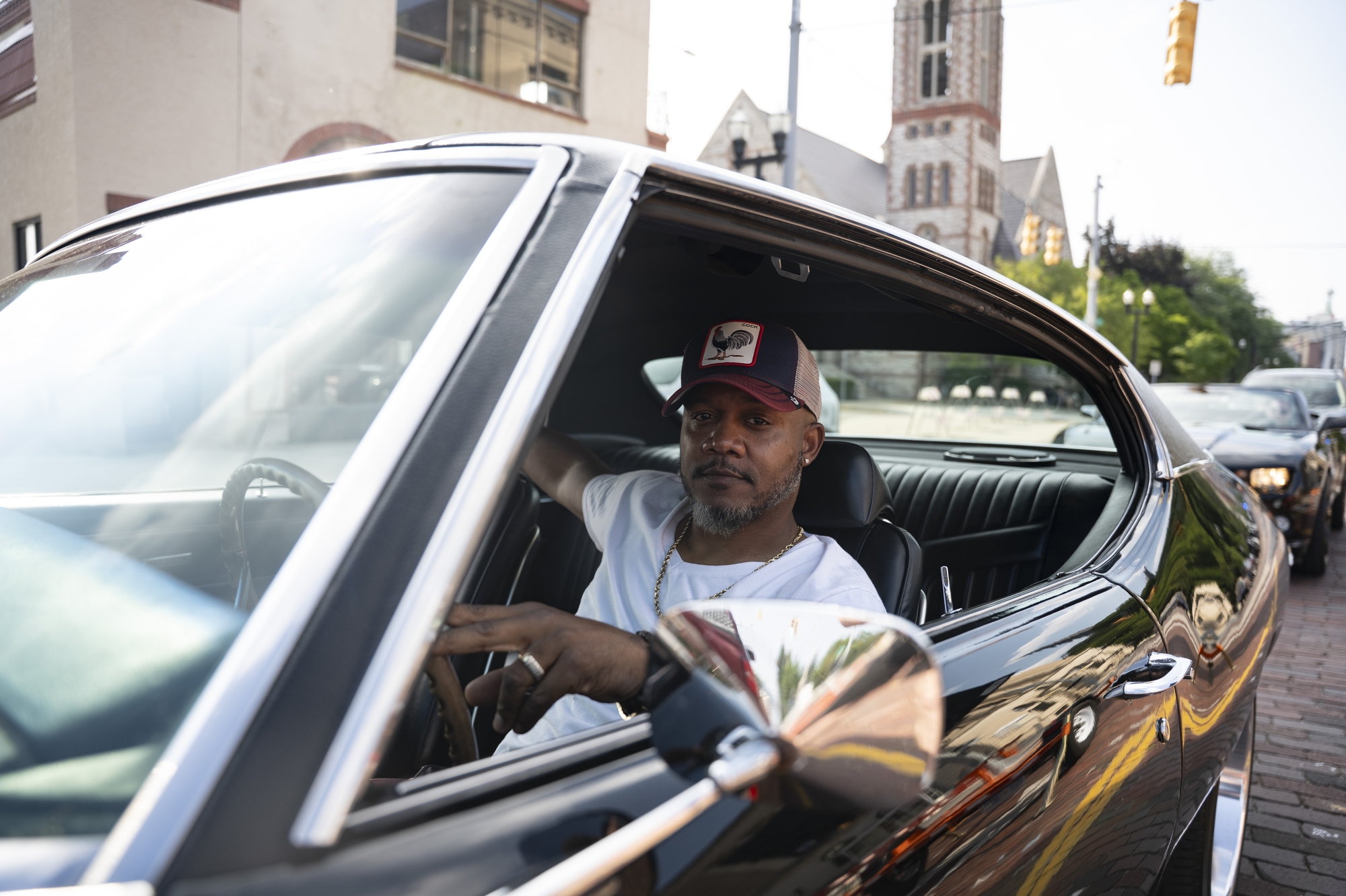 Car enthusiasts enjoy Back to the Bricks Rolling Cruise in Flint on Thursday, August 14, 2025.