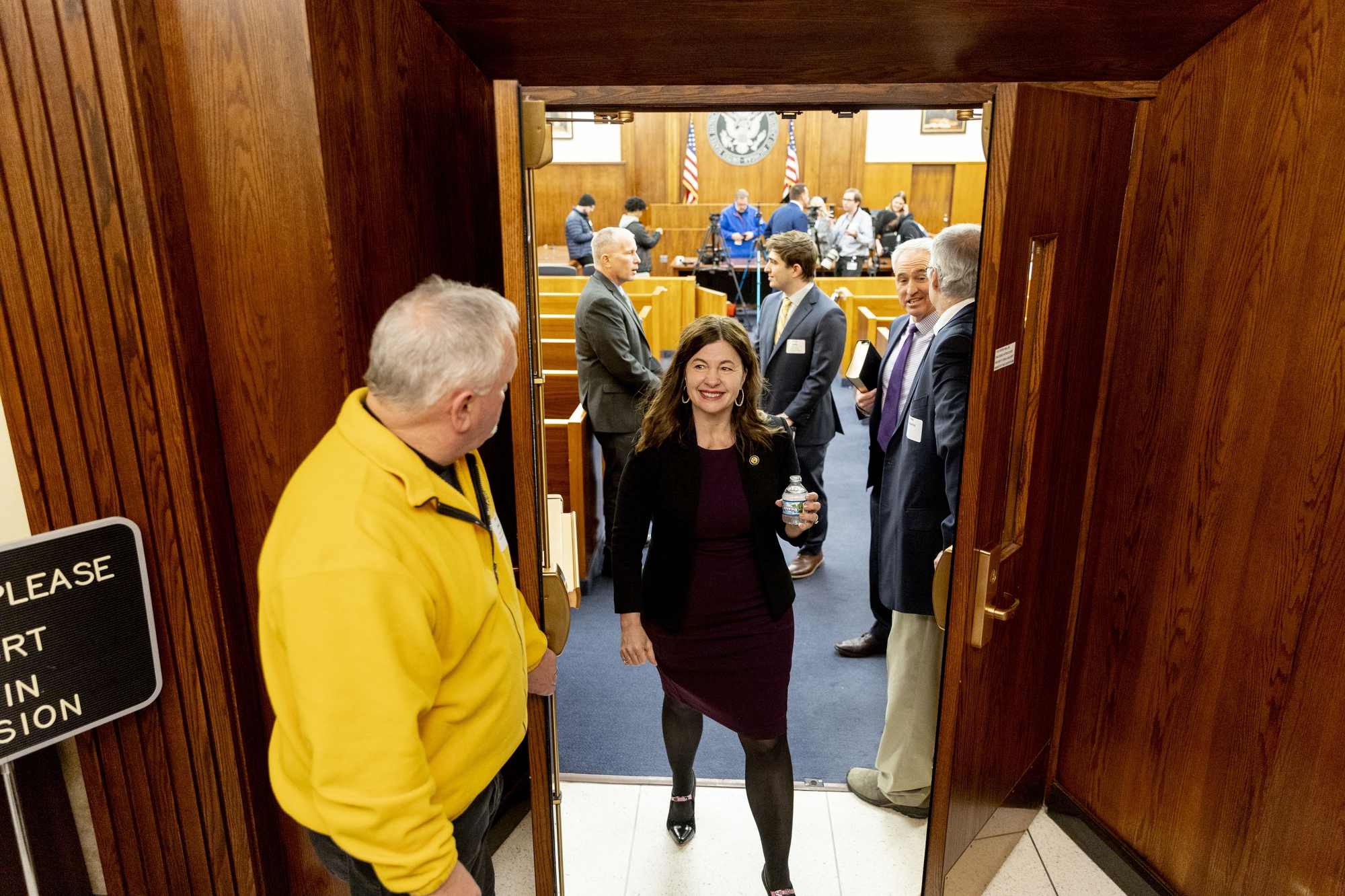 UAW Region 1 Director Steve Dawes holds the door open for Congresswoman Kristen McDonald Rivet, D-Bay City, after she was sworn in by Federal Judge Shalina D. Kumar at the Federal Building and U.S. District Courthouse on Monday, Jan. 27, 2025 at the Federal Building and U.S. District Courthouse in Flint. McDonald Rivet delivered remarks outlining her vision and goals for the 119th Congress. Jake May | MLive.com