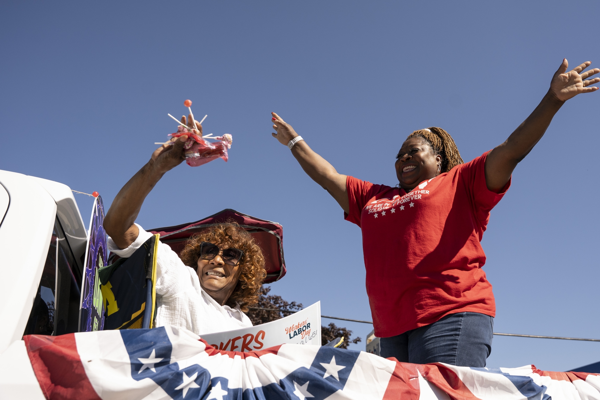 Local 651 members throw candy to spectators during the Flint Labor Day Parade on Monday, September 1, 2025.