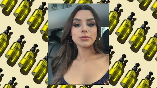 Siena Gagliano on a background of green bottles