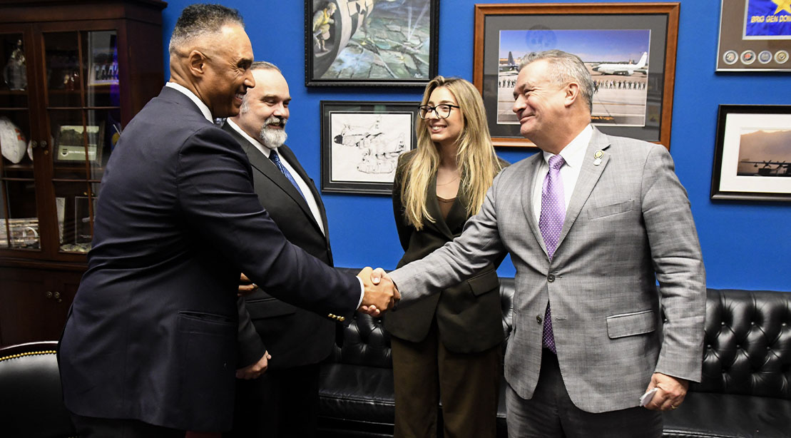 Don Bacon shaking hands with Rob Wilkens