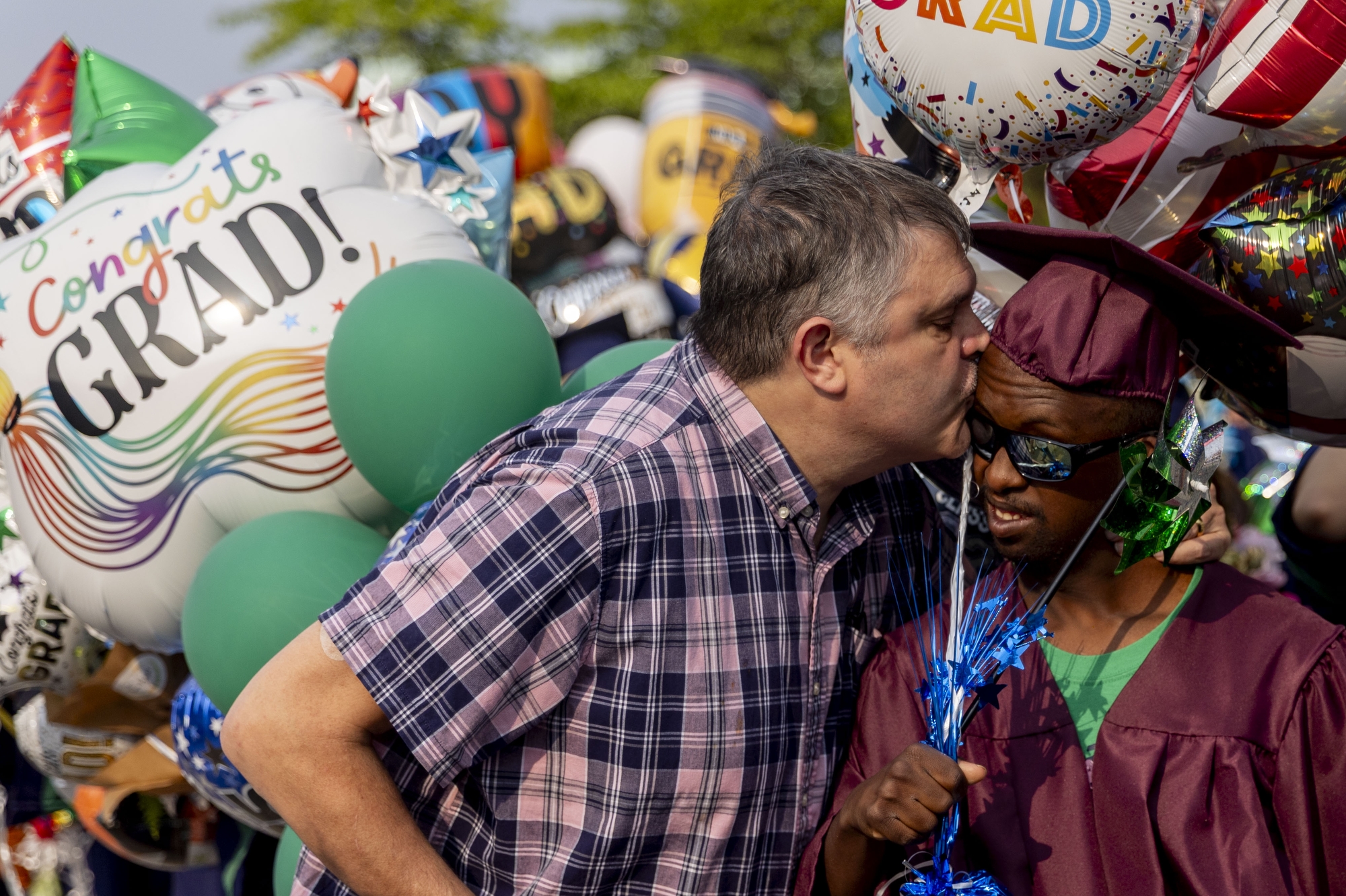 About 329 Lapeer seniors in the graduating class of 2025 parade in their caps and gowns along Nepessing Street on Tuesday, June 3, 2025 in downtown Lapeer as they participate in Swing Out, a longtime tradition of graduates that allows family and friends to show their support and love.