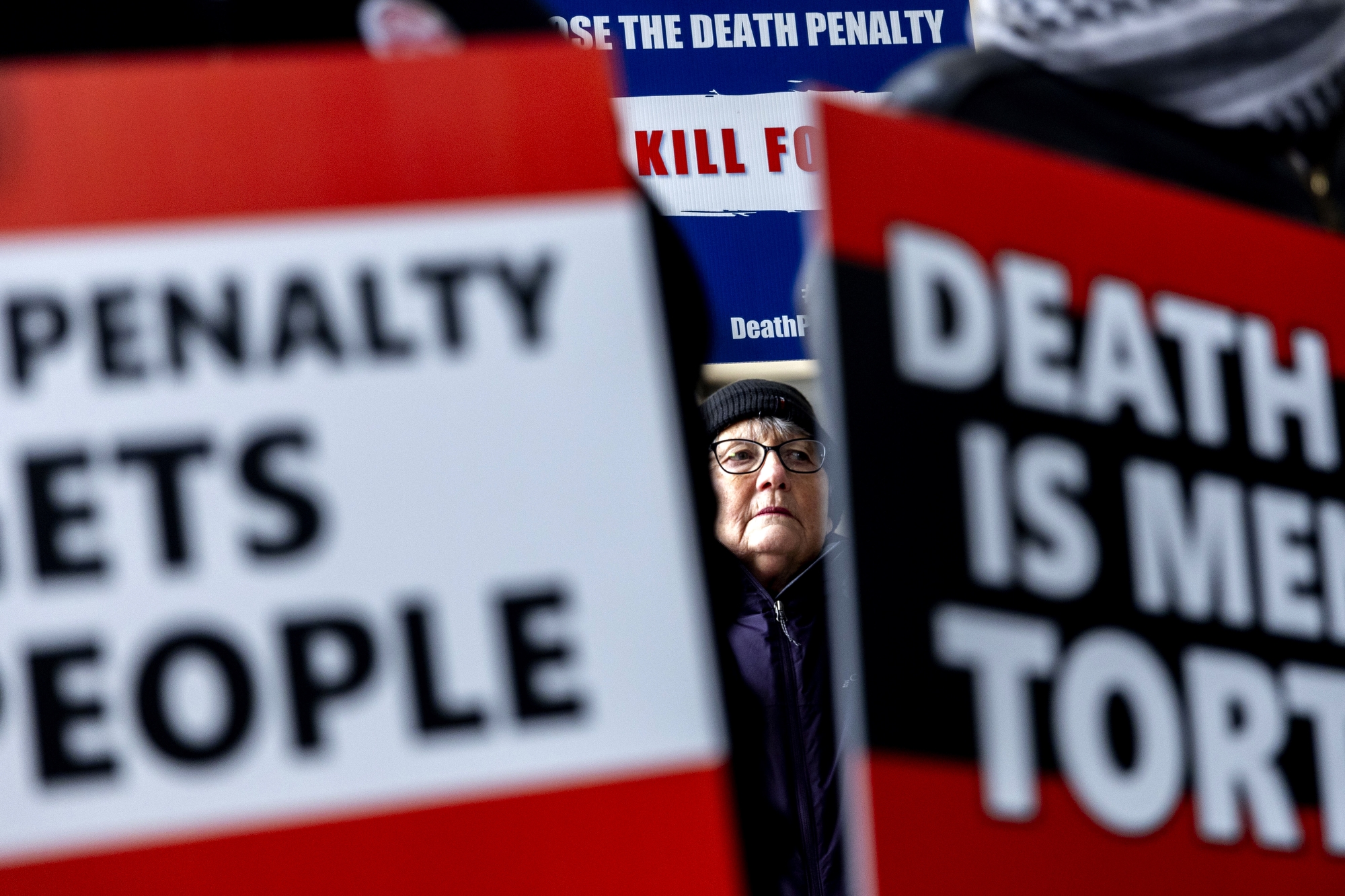 Michigan resident Beverly Leaf stands in solidarity with  Carol Frazier, mother of Demetrius Frazier, as she pleads publicly on Tuesday, Jan. 28, 2025 to Gov. Gretchen Whitmer to bring home her son Demetrius Frazier, a Detroit man convicted of rape and a separate murder of a 14-year-old in the early 1990s who was serving a life sentence when he was charged with another murder in Alabama. Carol Frazier delivered a letter to the Gov. Whitmer's office in the George W. Romney Building in Lansing requesting she give an executive order requesting her son’s return to Michigan before he is executed as early as Feb. 6 in Alabama through the death penalty. 