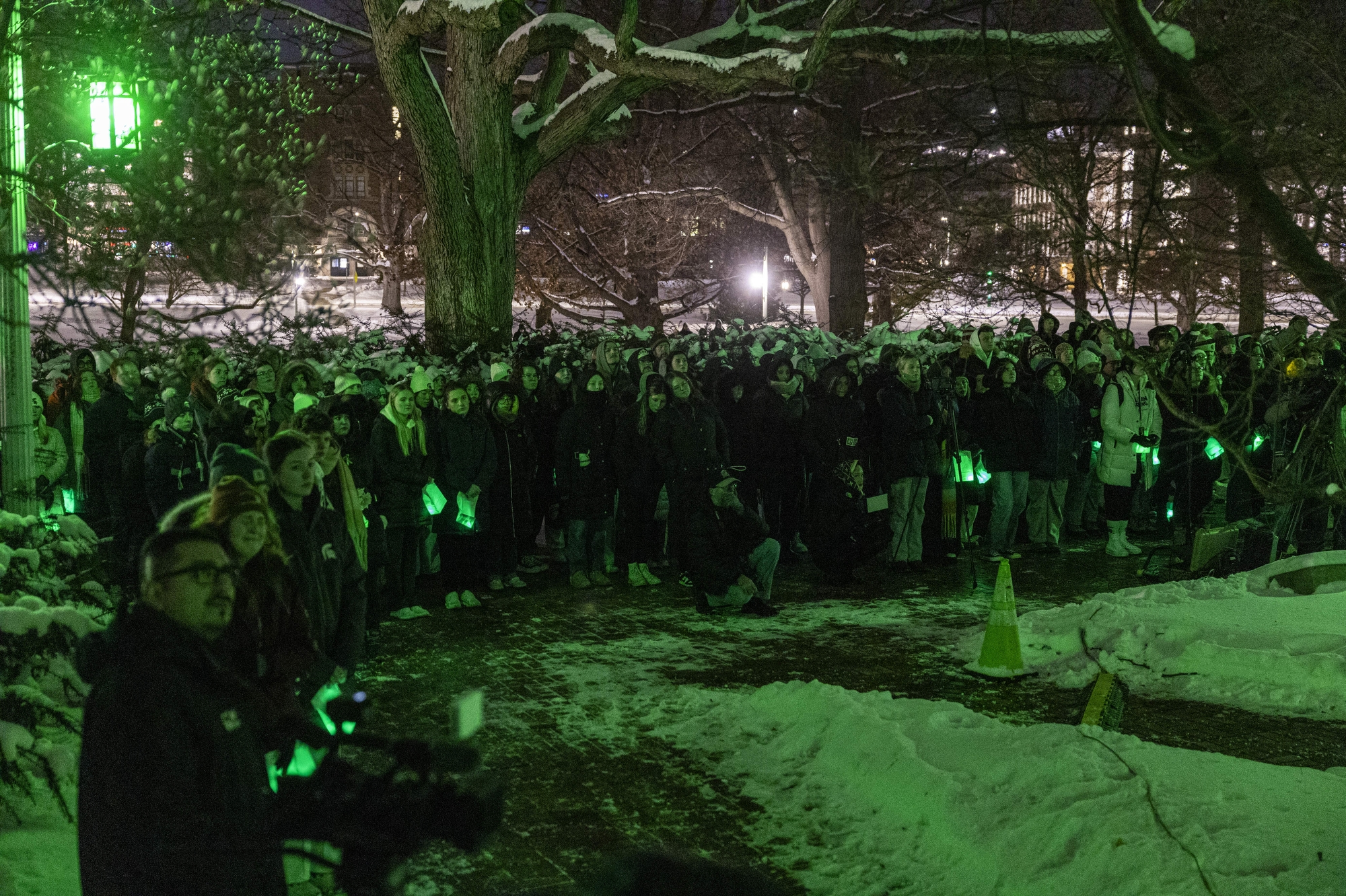 Students surround Beaumont Tower for a moment of silence followed by the ringing of bells from the Beaumont Tower on Thursday, Feb. 13, 2025, at Michigan State University in East Lansing.