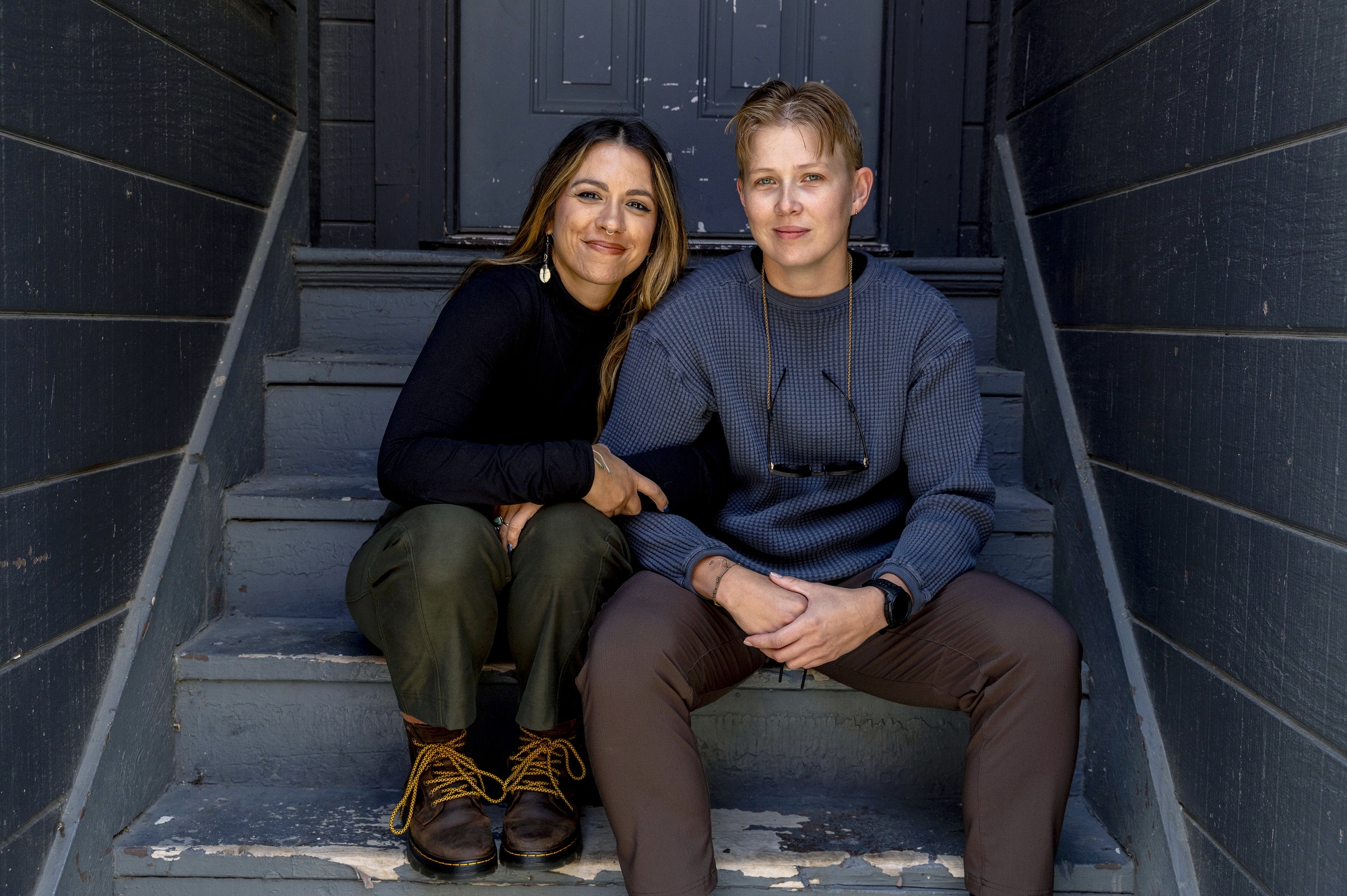 Flint residents Jenifer Veloso and her partner Sarah Satkowiak (pictured left to right), as well as Sarah’s father Pete were traveling to different spots along the 10-mile course to photograph participants when racers flagged them down at the Crim Festival of Races.. All three have medical experience — even though they were only there to take photos. Unexpectedly, they became lifesavers. What happened next was a life-saving effort to help a runner who went into cardiac arrest during the Aug. 24 event. (Jake May | MLive.com)