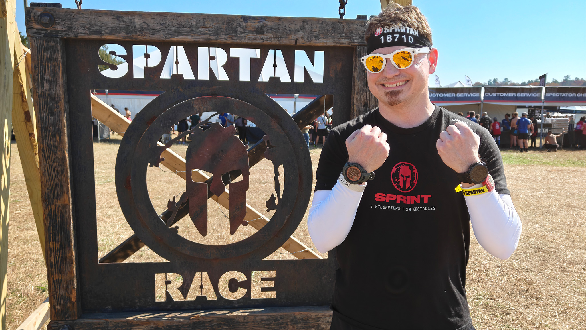 Me at a Spartan Race wearing Oakley Meta HSTN smart glasses, an Amazfit T-Rex 3 Pro, and a Garmin Insinct 2X Solar