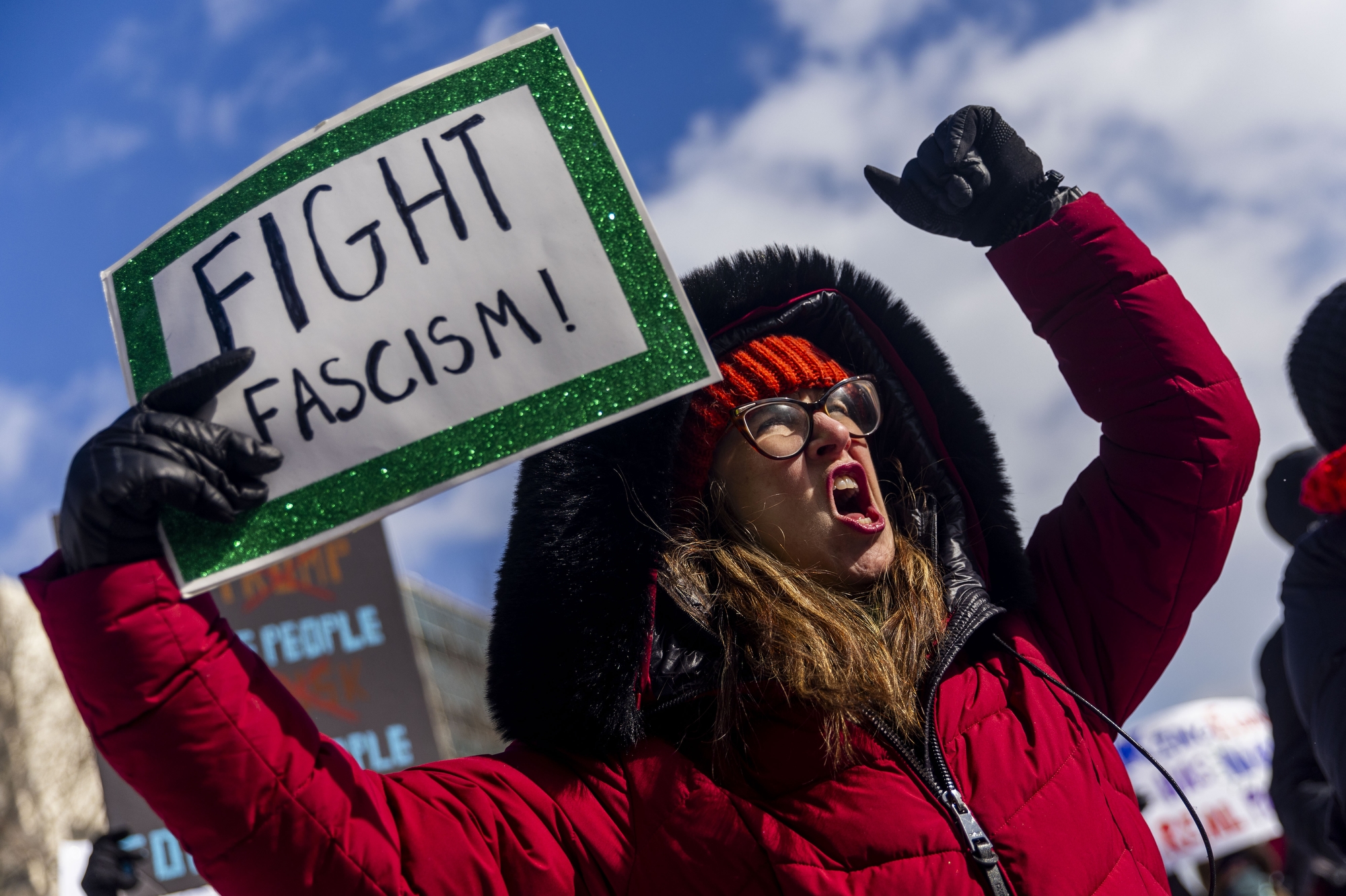 Christina Sears of Ypsilanti shouts out against President Donald Trump while holding a sign that reads “Fight Fascism!” amidst more than 700 people gathered at the steps of Michigan's Capitol to protest in defiance of Trump and his second administration on Monday, Feb. 17, 2025 on Presidents' Day in Lansing.