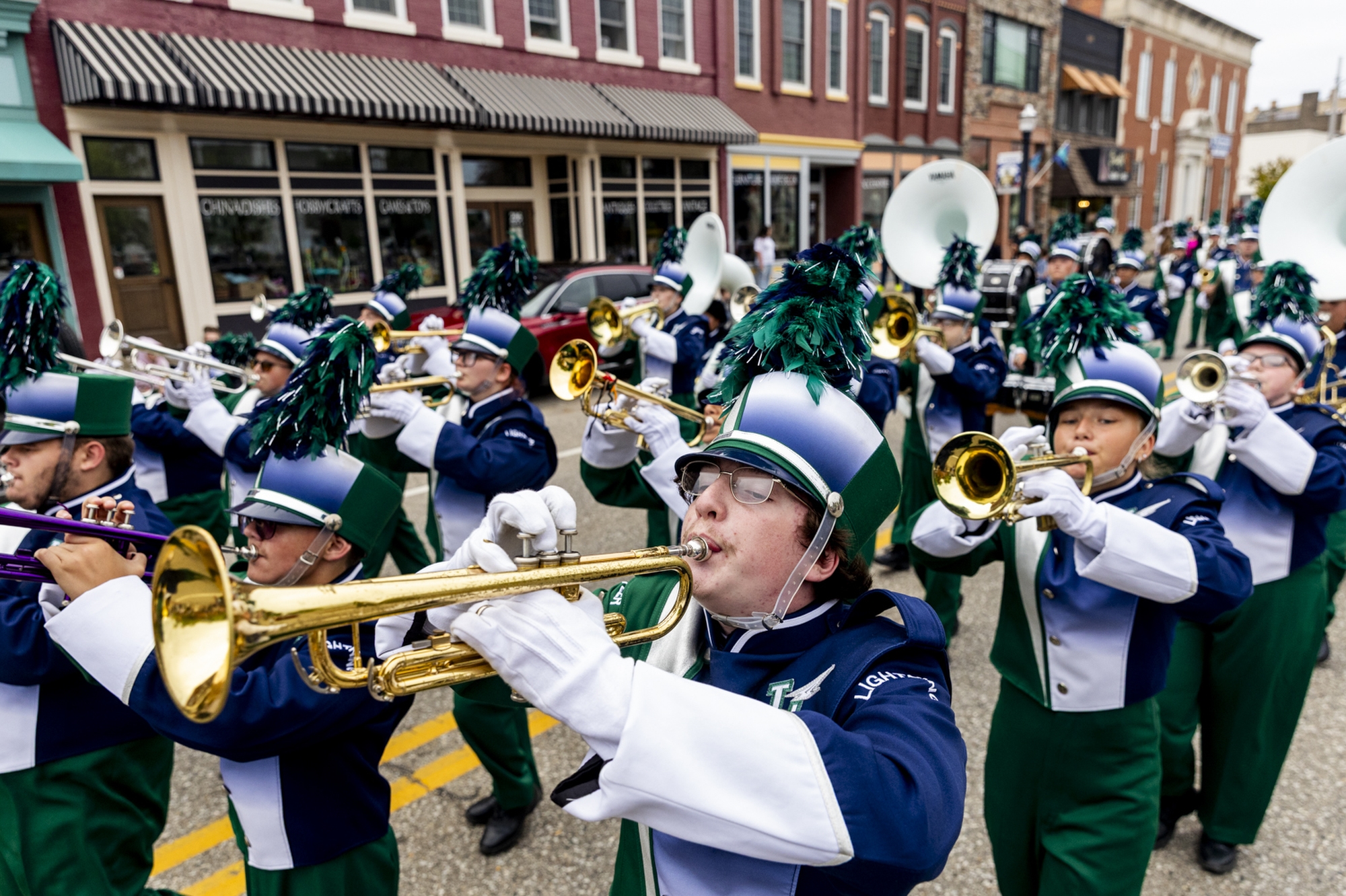 The Lapeer marching band performs while leading the homecoming parade on Friday, Sept. 19, 2025 along Nepessing Street in downtown Lapeer. (Jake May | MLive.com)