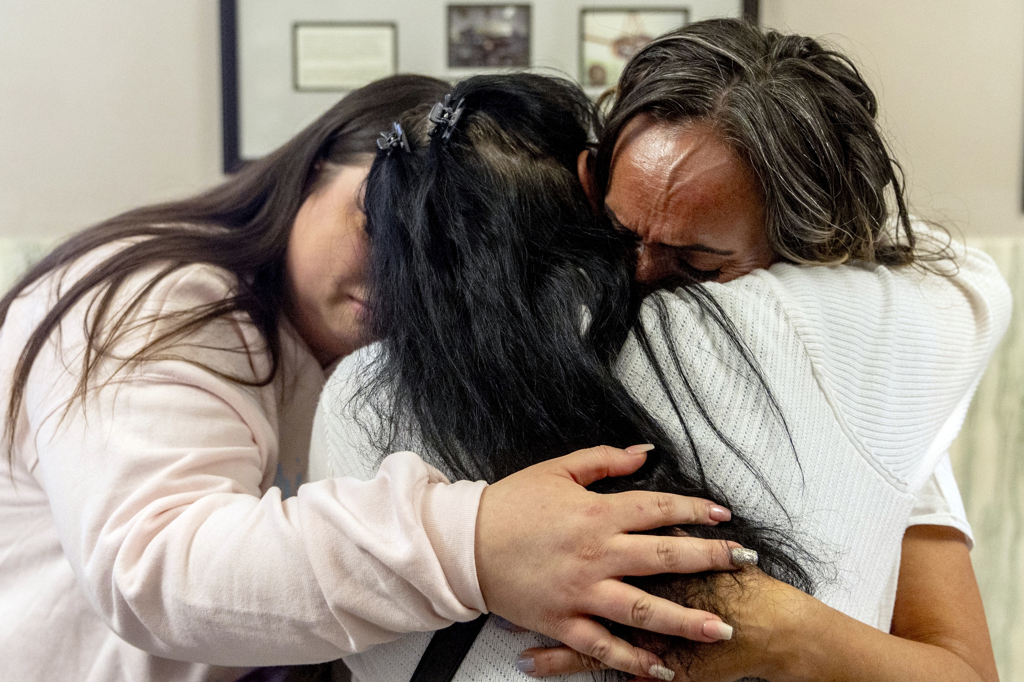 Juanita Skaggs, mother of Alicia Jackson-Skaggs at right, cries out as Alena Gonzalez and other family embrace in the hallway of the Genesee County Circuit Courthouse on Monday, March 10, 2025, after Deondre McLilly, 25, and his mother Windy Weatherford, 49, were each sentenced to serve more than 30 years in prison after being convicted of killing Alicia Jackson-Skaggs in Flint Township in March 2022.