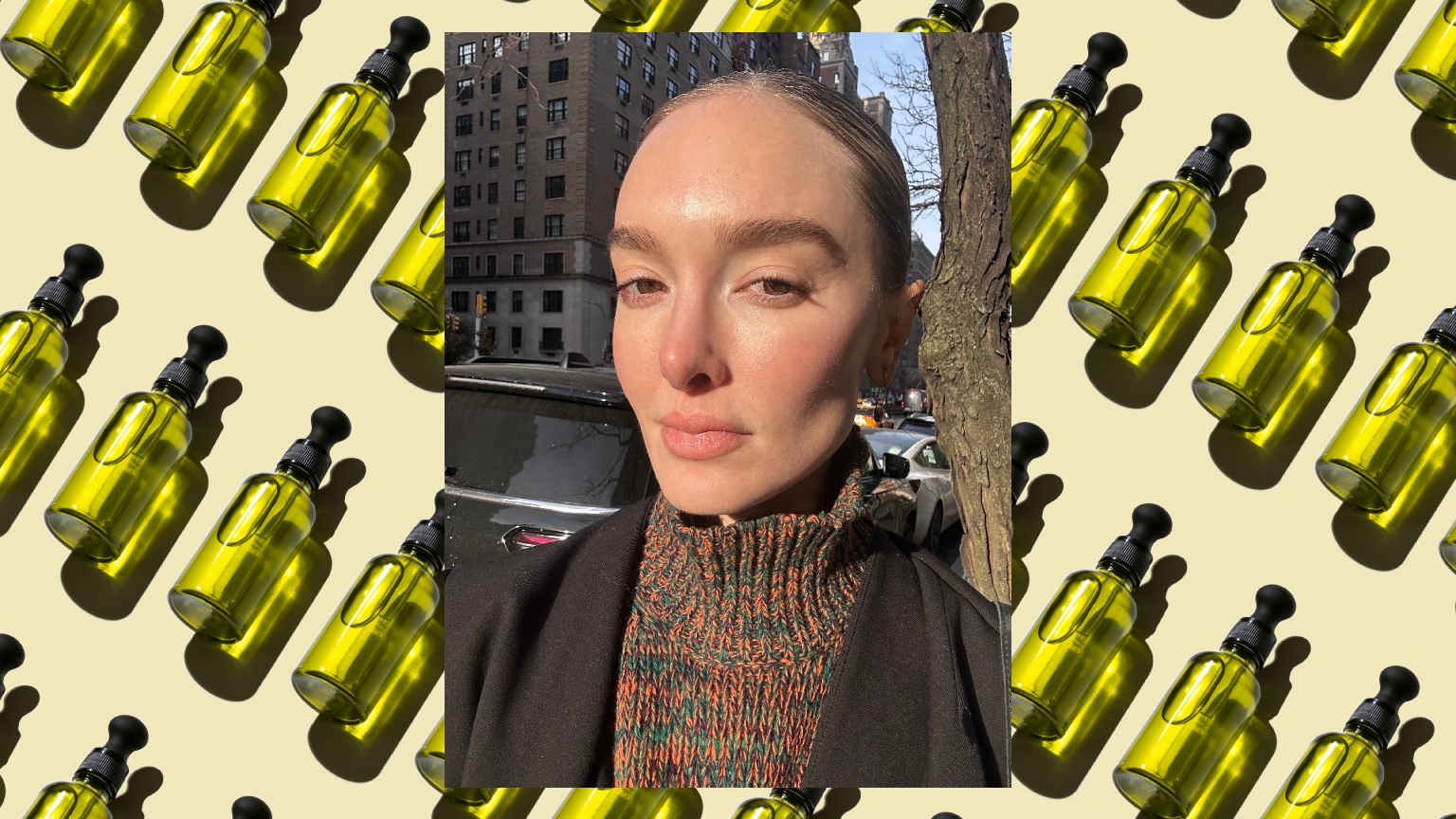 a woman with glowing skin wearing a turtleneck sweater over a background of green glass bottles