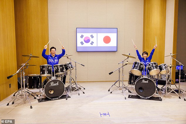 South Korea's President Lee Jae Myung (left) and Japan's Prime Minister Sanae Takaichi (right) playing the drums in Nara, western Japan on January 13