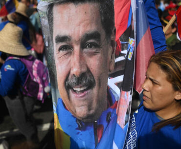 A demonstrator holds a picture of ousted Venezuela's President Nicolas Maduro during a rally to support him and his wife Cilia Flores in Caracas, Venezuela, on Jan. 6. [AFP/YONHAP]