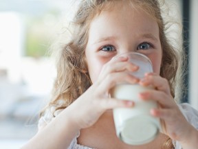 Girl drinking glass of milk