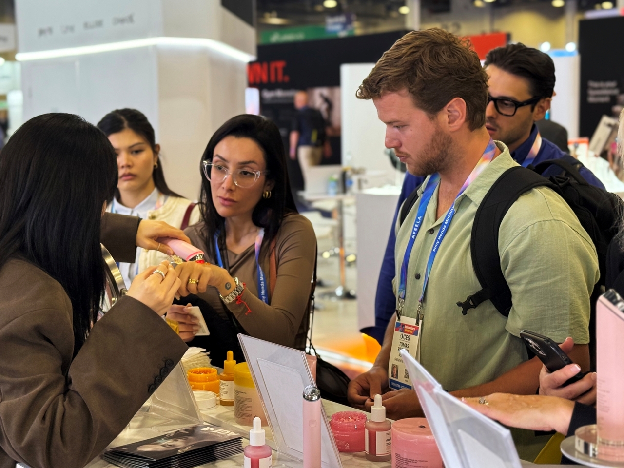 Visitors test Medicube’s Age-R beauty device at APR’s booth at CES 2026 in Las Vegas. (APR)
