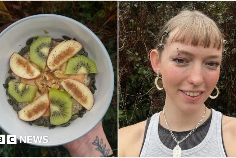 A photo from above of a table with bowls of chickpeas, mashed avocado, nuts, seeds and salads. In the middle of the table, a pair of hands are spreading avocado on slice brown bread