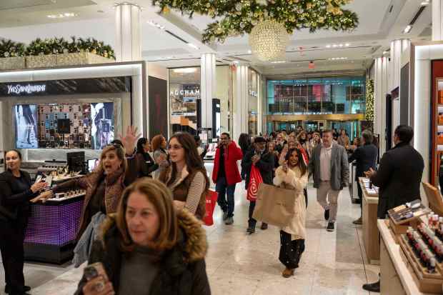Customers walk into Macy's flagship store in New York. (AP Photo/Yuki Iwamura)