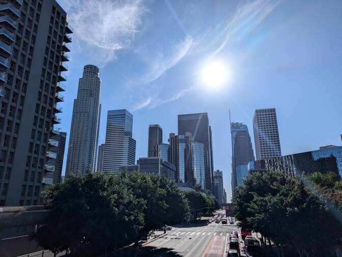 A street shot of a downtown skyline.