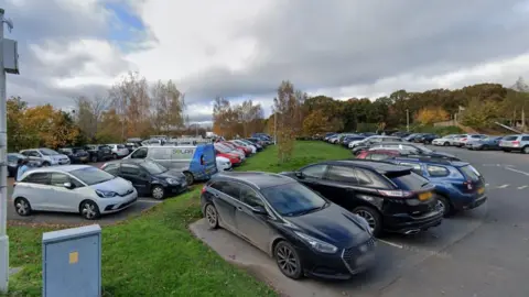 Google Maps General view of rows of cars parked at Worcester Woods Car Park.