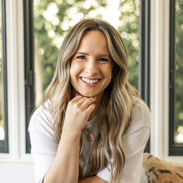 Carly Zanoni poses for a headshot.