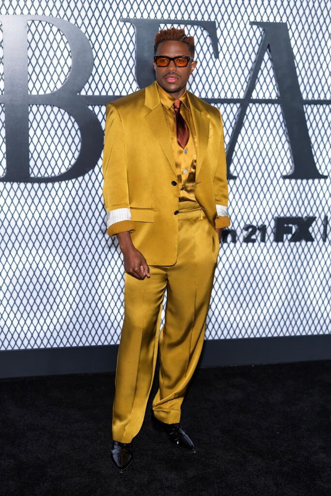 Jeremy Pope, Jeremy Pope red carpet, The Beauty New York premiere, Jeremy Pope Saint Laurent Spring 2026, Saint Laurent menswear, Anthony Vaccarello, saffron suit, silk duchess satin suit, Law Roach styling