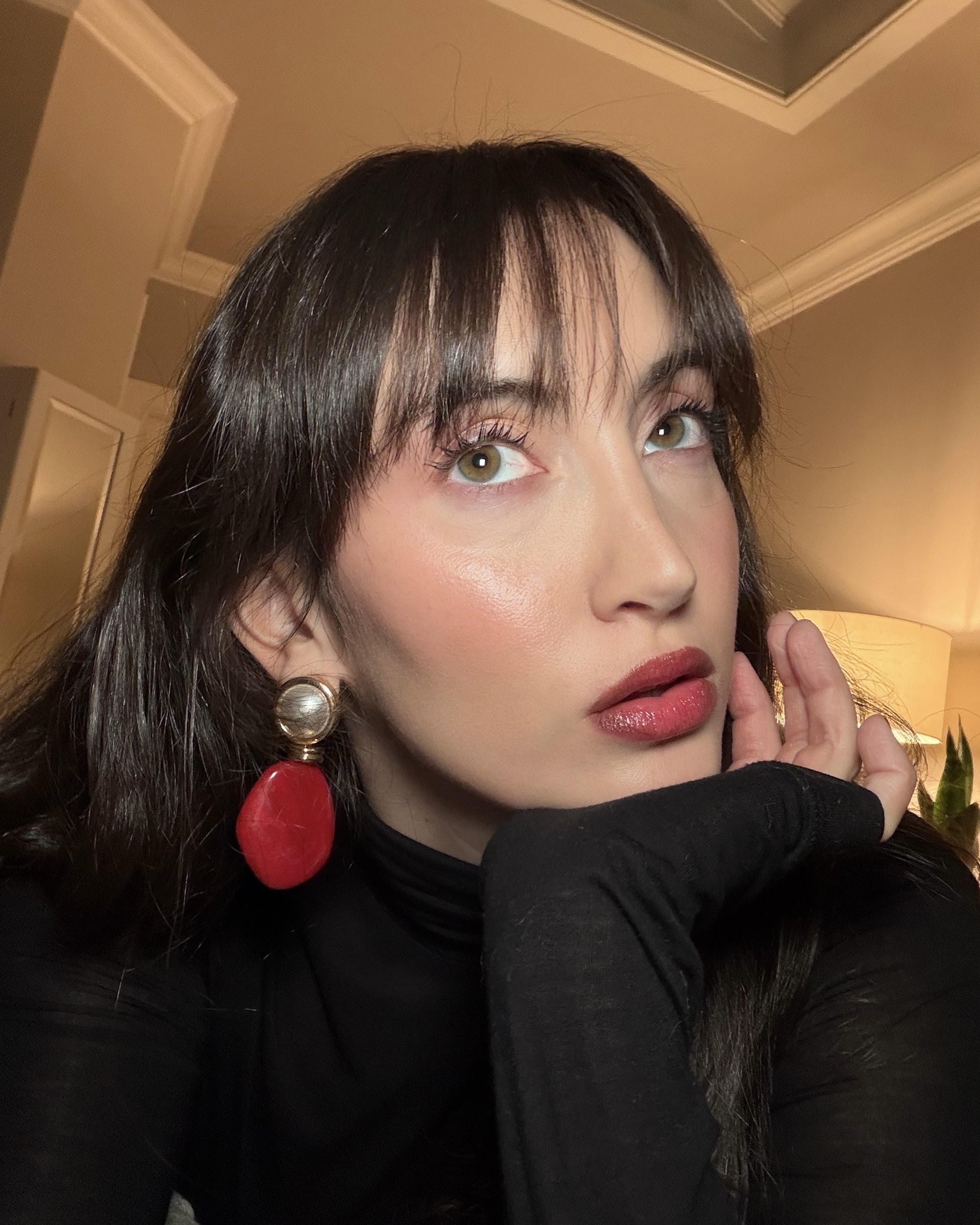 An image of Alyssa Brascia wearing the It Cosmetics Do It All Sheer Tint Face Balm.