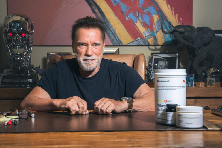 Arnold Schwarzenegger with Momentous supplement stack