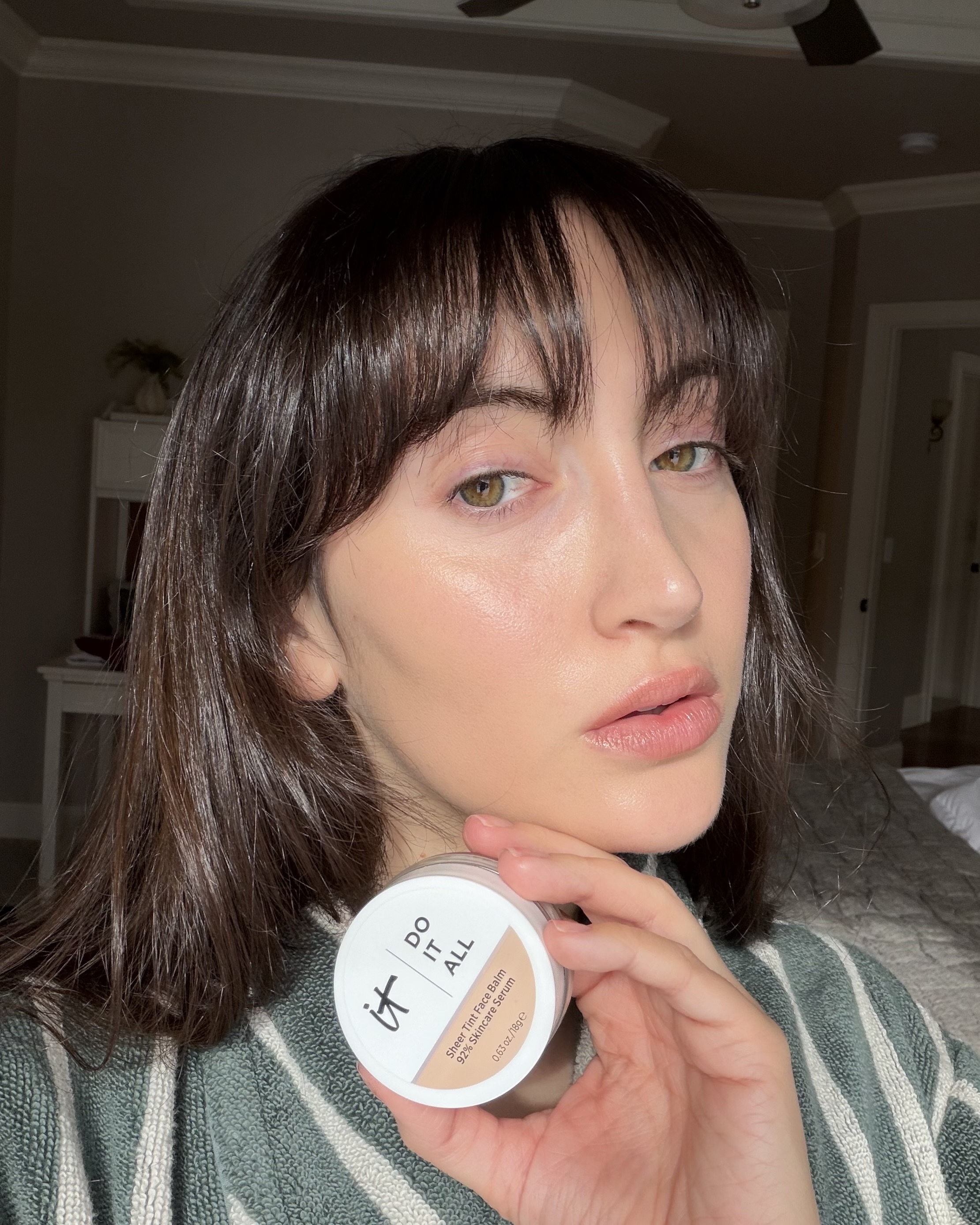 An image of Who What Wear associate beauty editor Alyssa Brascia wearing the It Cosmetics Do It All Sheer Tint Face Balm.