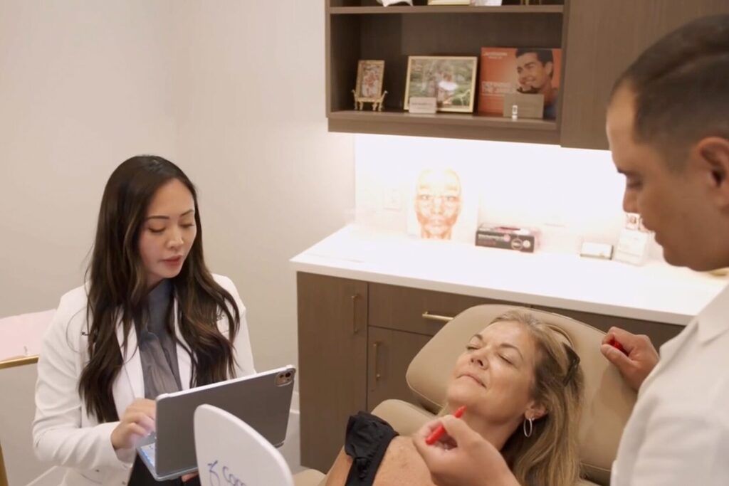 Recia Swanson, of New Beauty Aesthetics Academy in St. Johns County, discusses a treatment plan with a patient.
