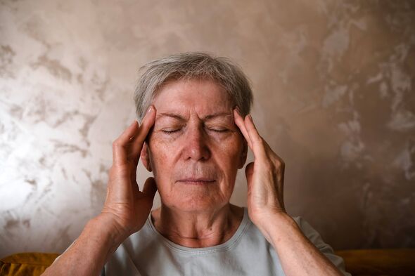 Senior woman having headache. Close up.