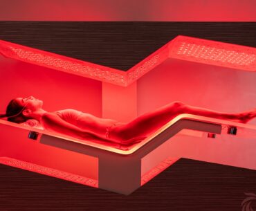wellness trends - woman lying on Ammortal infra red bed