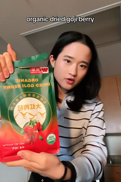 TikTok video of a woman showing the camera a bag of organic dried goji berries.