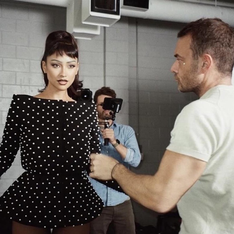 Dimitris Giannetos styles Shay Mitchell's hair in a retro ponytail with micro bangs.