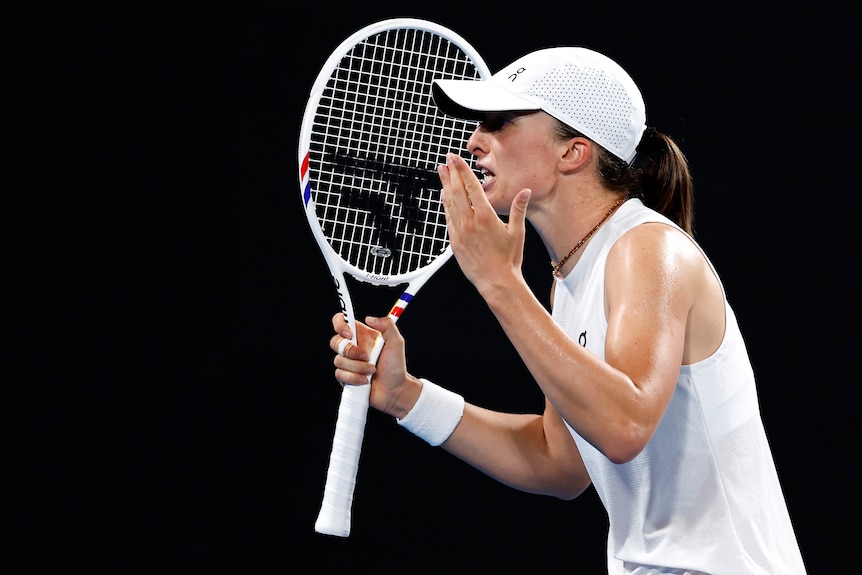 Iga Swiatek shouts during a match for Poland in the United Cup.