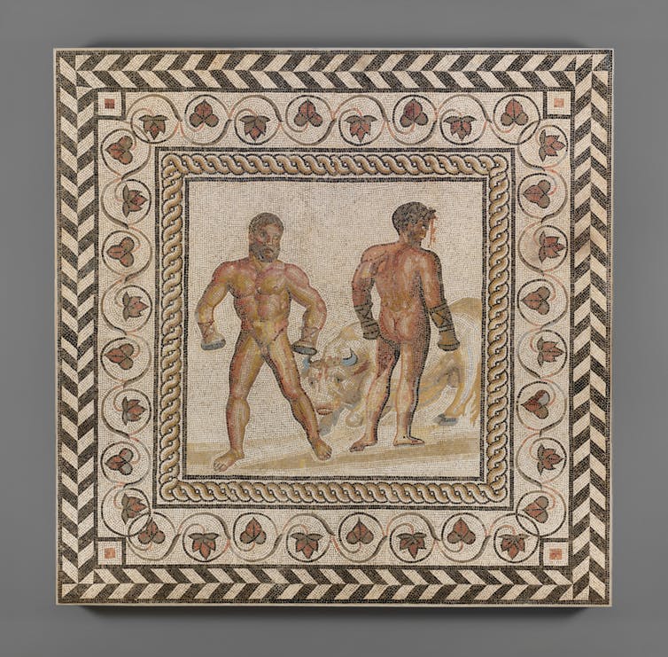 A beautiful tile mosaic with two nude boxers.