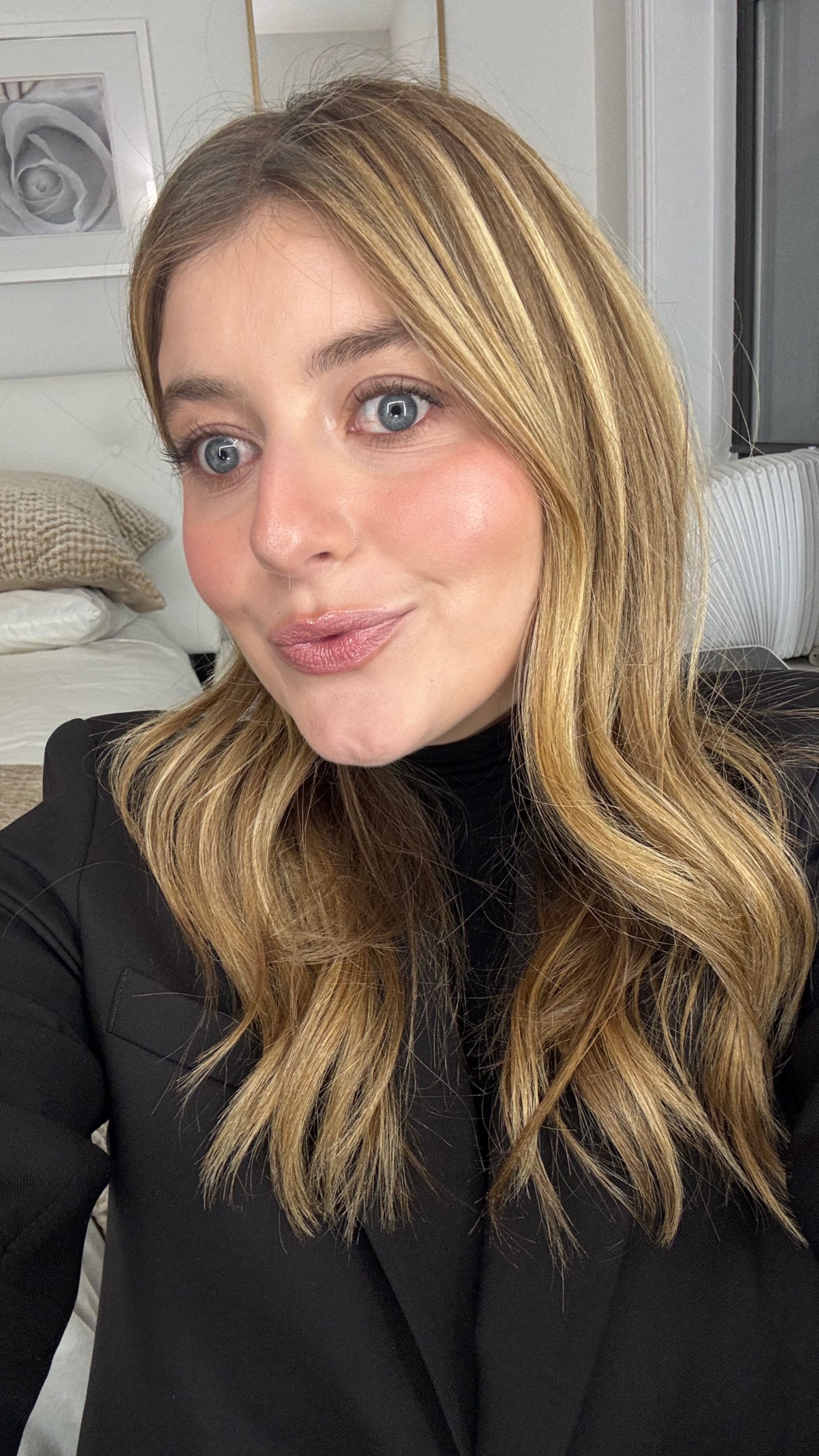 Samantha Holender wearing foundation with long blonde hair in a black shirt