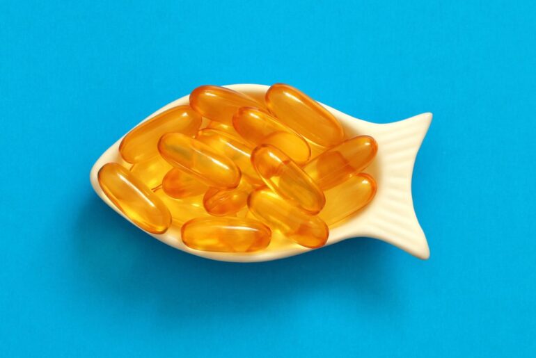 dietary supplement omega in a white bowl in the shape of a fish