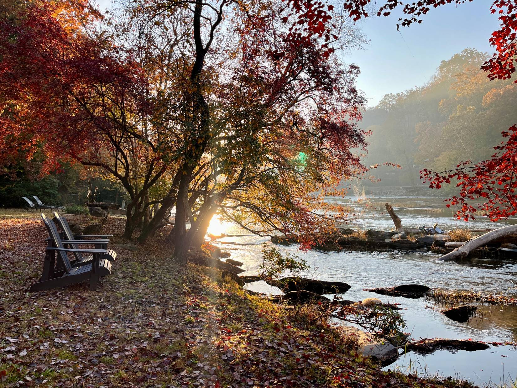 Two chairs by a river in Ellijay, Georgia