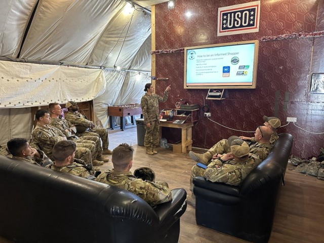 Capt. Katharine Long conducts a class on supplements to a group of Soldiers while deployed to Iraq.