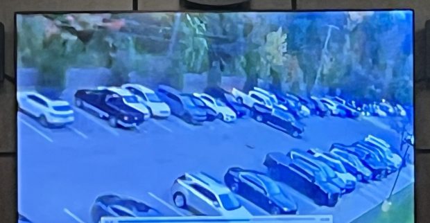 Security video from Lifetime Fitness in Shelby Township shows a black GMC occupied by some of the susepcts in the Lifetime Fitness abduction case pulling out of a parking spot after being parked next to Giovanni Plumaj's white Dodge Ram pickup truck shortly before the incident.MACOMB DAILY IMAGE FROM POLICE VIDEO