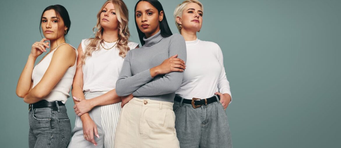 A group of fashion models posing together.