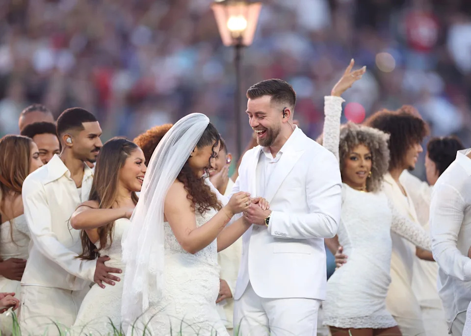 SANTA CLARA, CALIFORNIA - FEBRUARY 08: A couple marries during the Bad Bunny performance onstage at the Apple Music Super BowlÂ LX Halftime Show at Levi's Stadium on February 08, 2026 in Santa Clara, California. (Photo by Kevin C. Cox/Getty Images)
